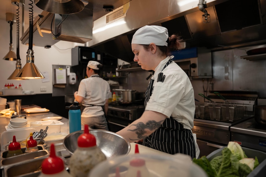 Two women working in a restaurant kitchen